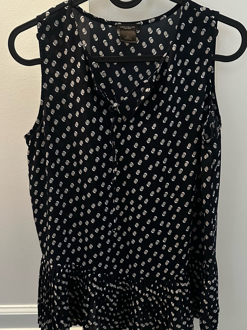 Ann Taylor Navy Blue with White Polka Dot Sleeveless Ruffle Hem Top